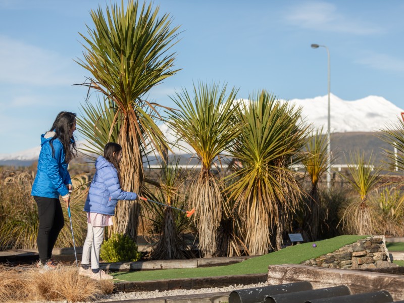 Playing mini golf in National Park Village